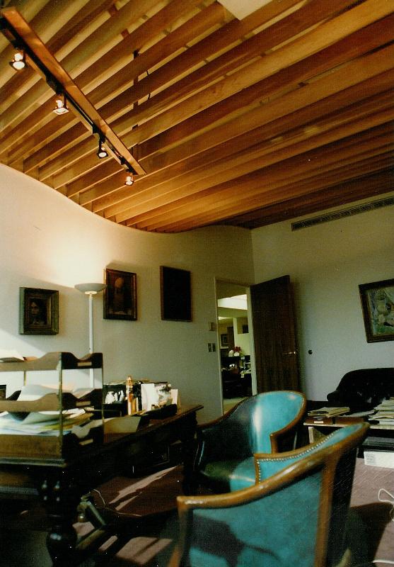 Looking back to the entry door to the office. The track lighting above the cedar