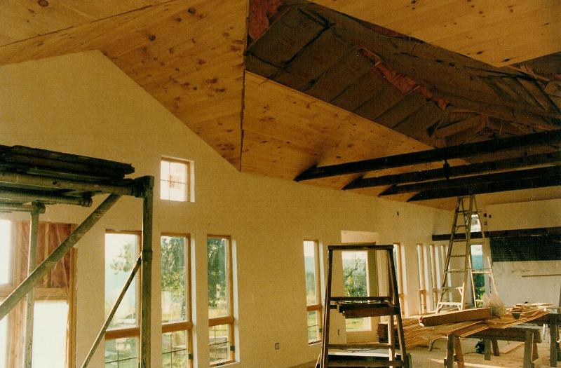 Looking south in the addition. The pine boards and additional insulation in the 