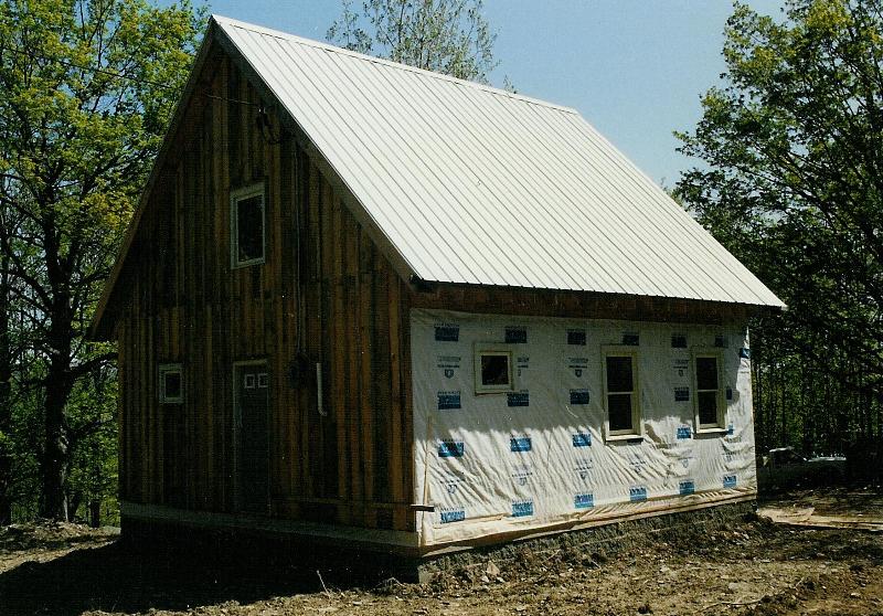 The back door, which opens into the Kitchen area. The roof is corrugated steel s