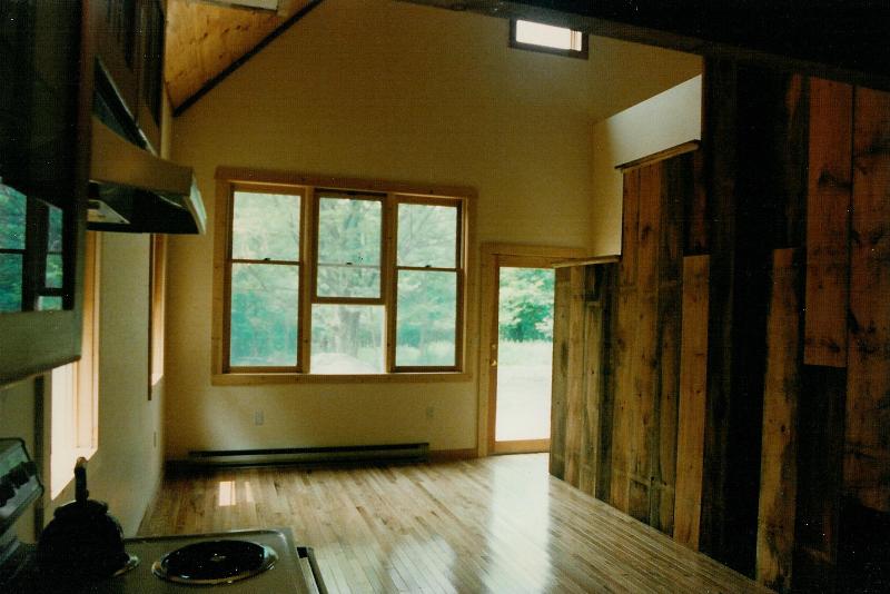 Looking from the Kitchen out through the Living Room. The rough hemlock wall is 