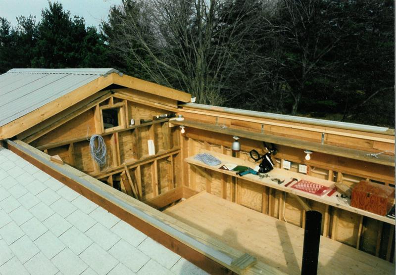 Looking down into the observatory with the roof slide back. The mount for the ne