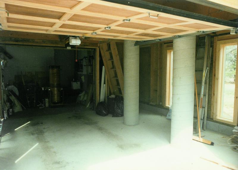 The garage. The concrete columns lined up with the tall skinny windows on the tw