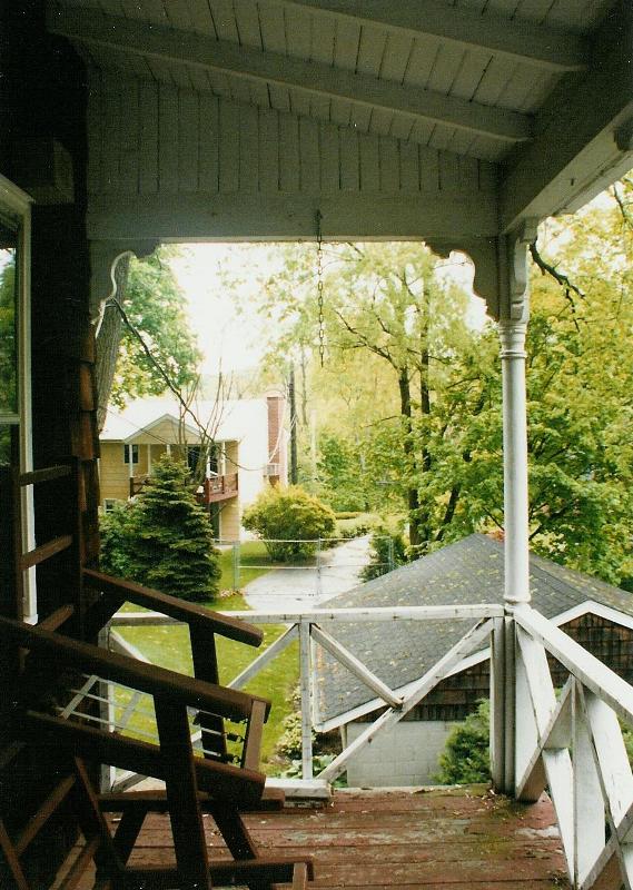 The original porch, with the decking deteriorating and the railing falling apart
