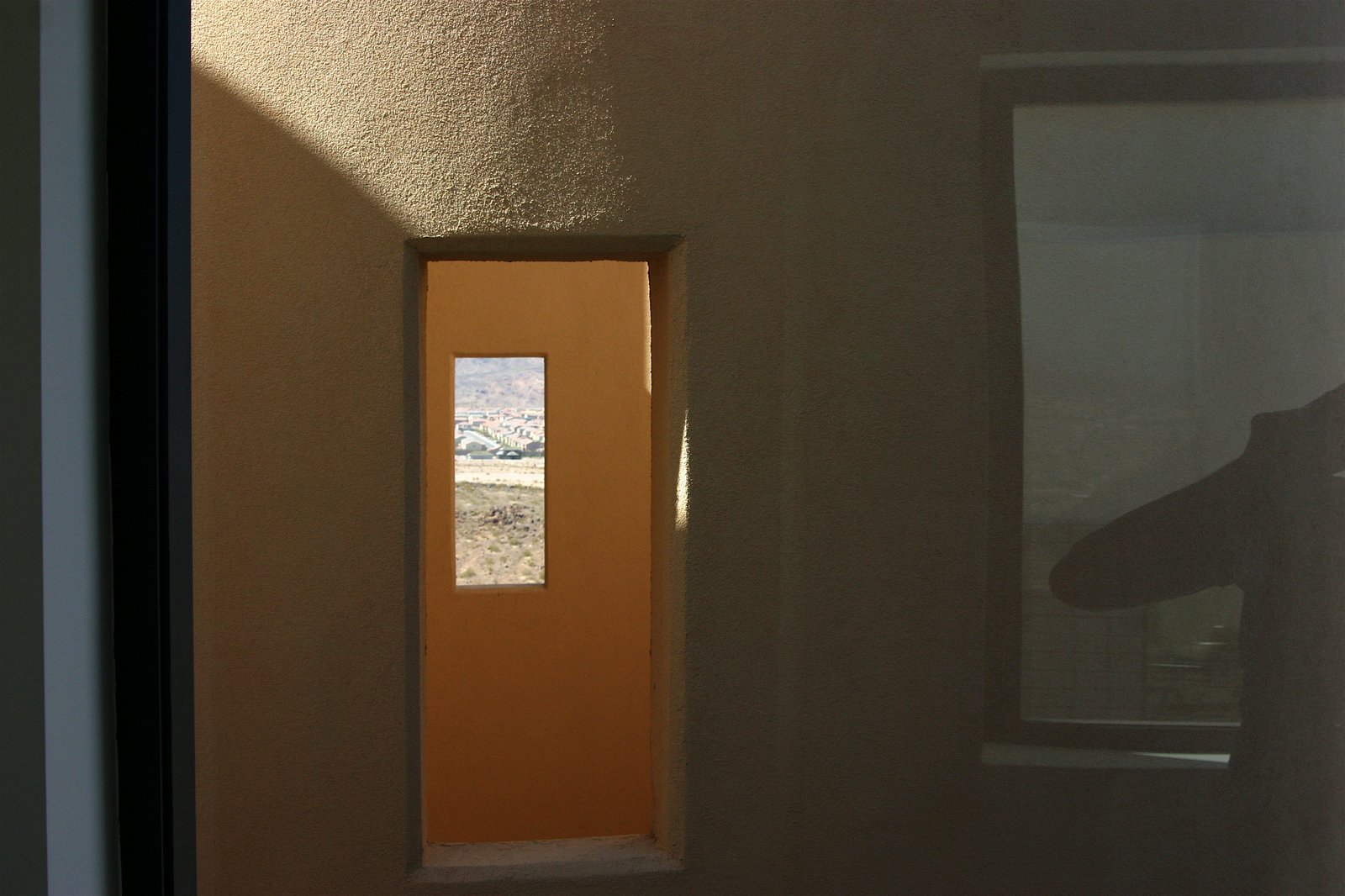 Looking through the stair tower at the second floor level, openings on opposite 