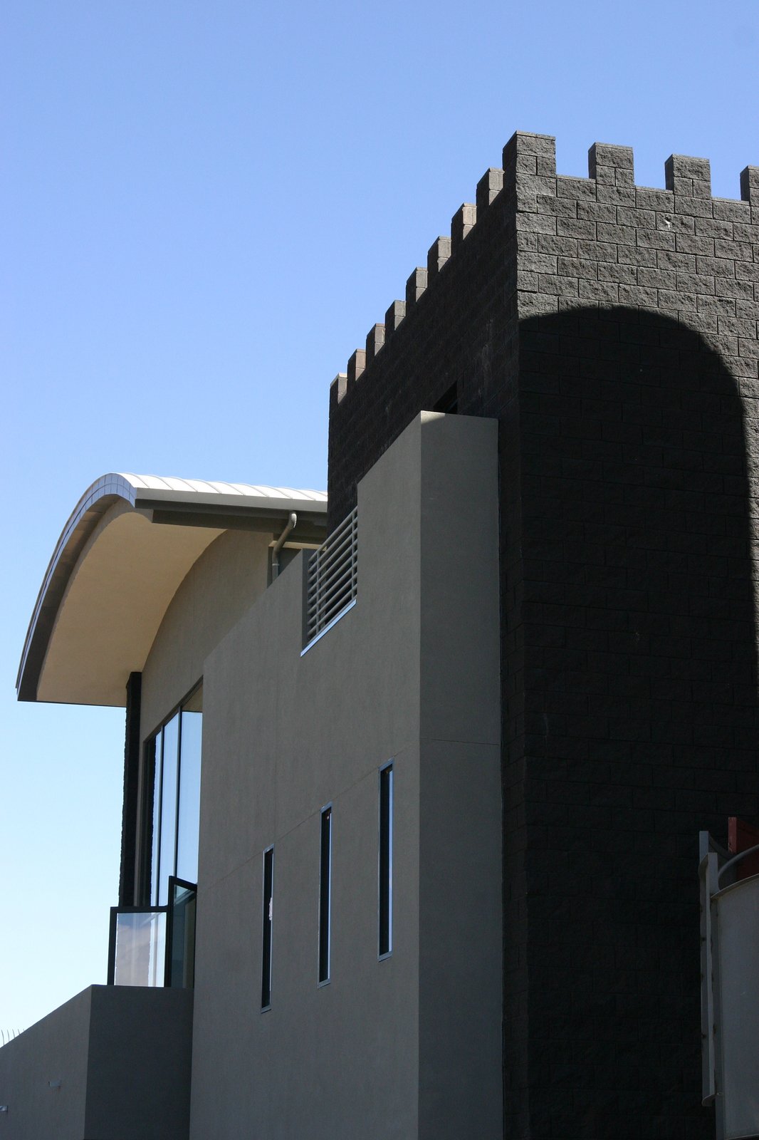 Looking up at the Home Theater and Reception Hall from the guest parking area in
