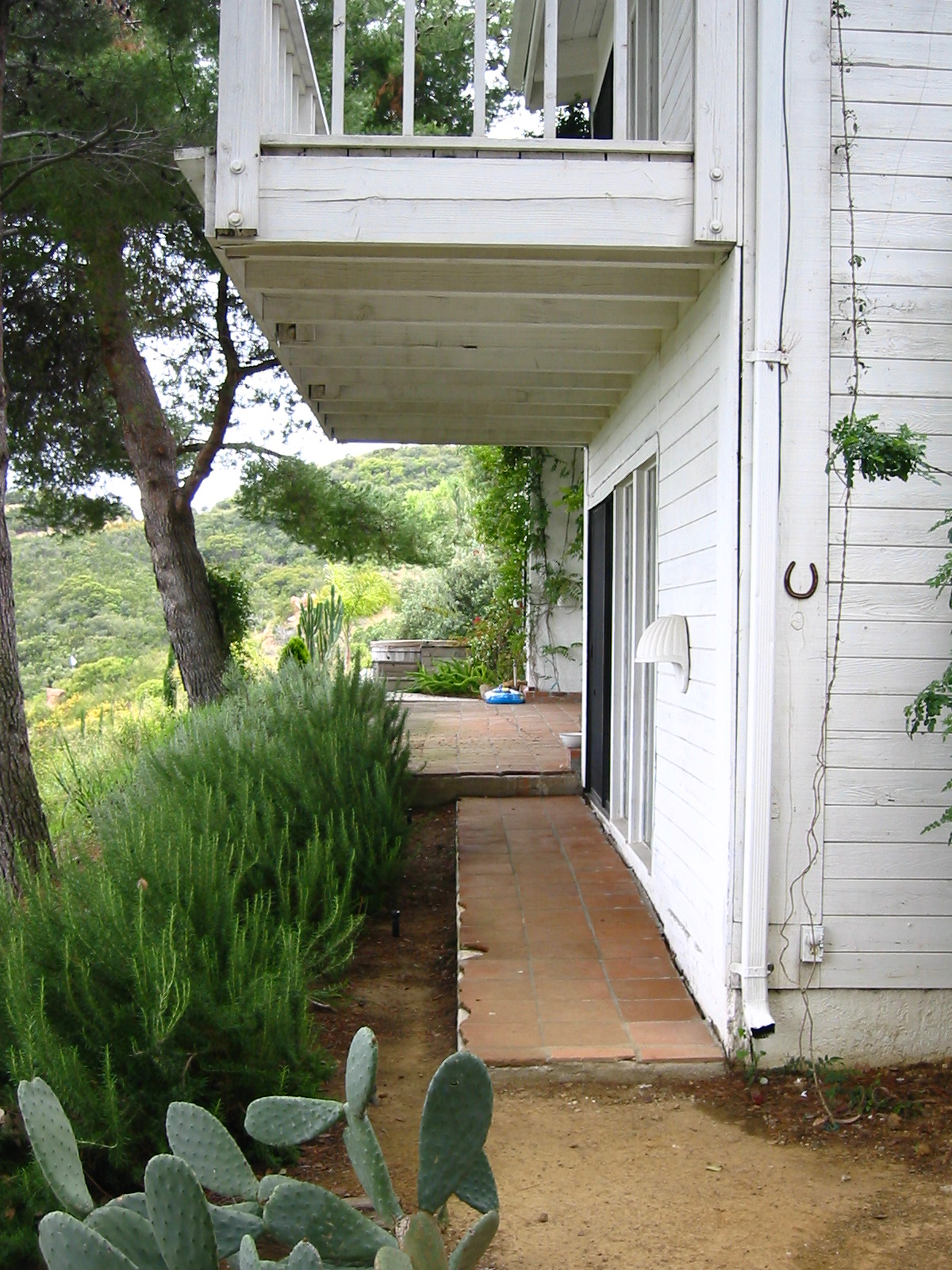 Looking down the west facade toward the hot tub.