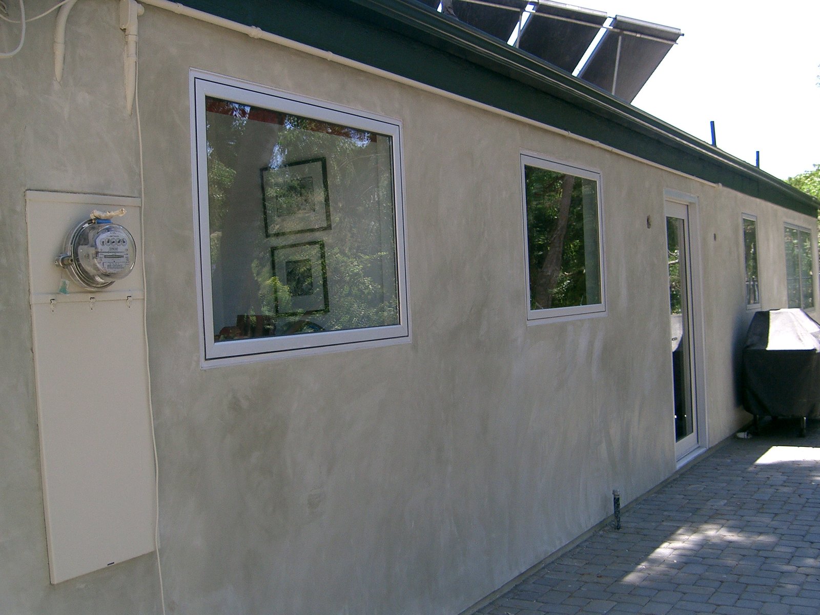 New stucco, windows and door into the Kitchen.