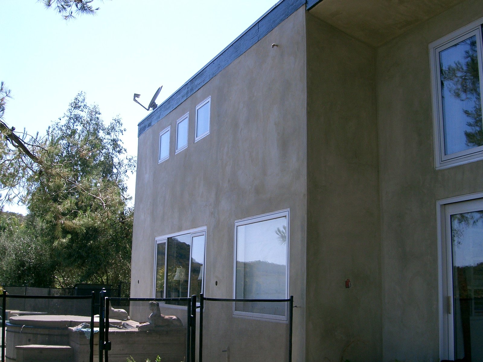 The new stucco and windows on the bedroom facing west.