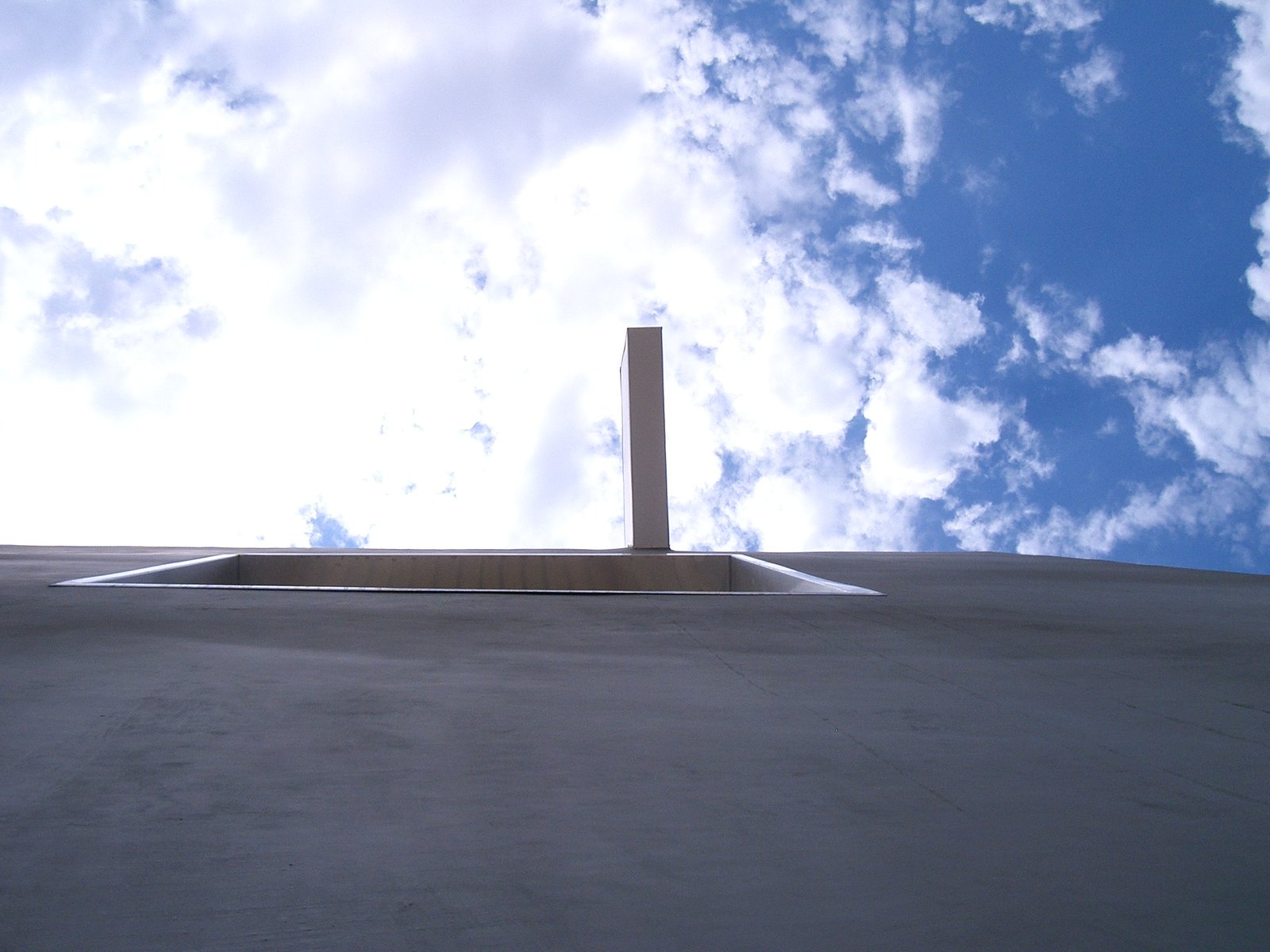 Looking up the tilted wall, the opening to the terrace is above, and the beam co