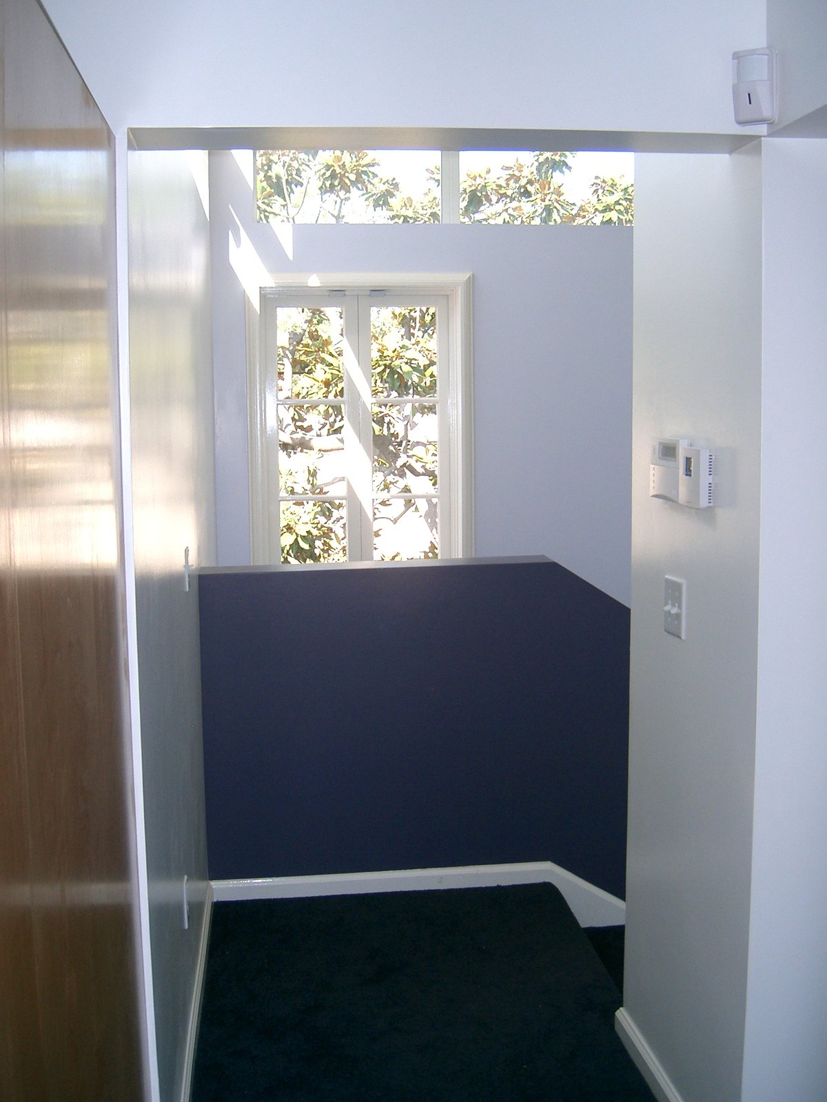 Looking into the stair tower from the hall next to the Master Bedroom. It is fil