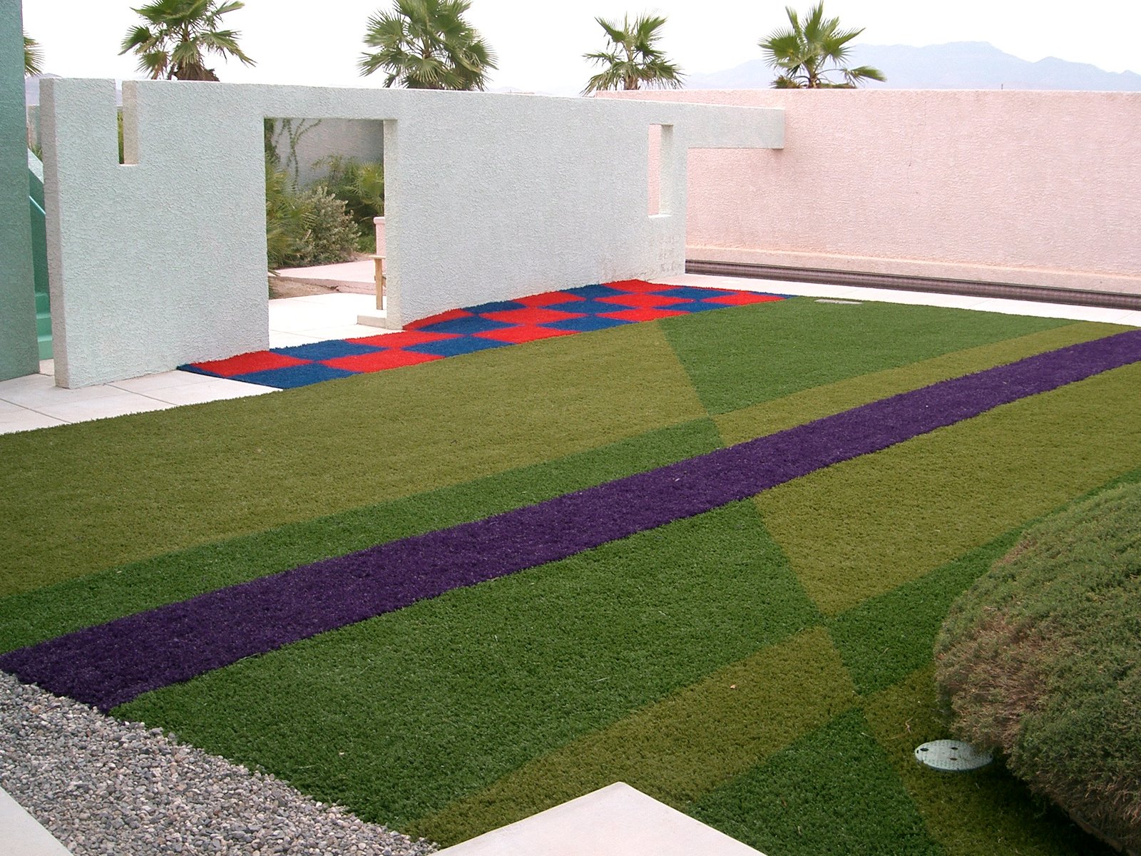 Looking across the grass from the walkway along the building.