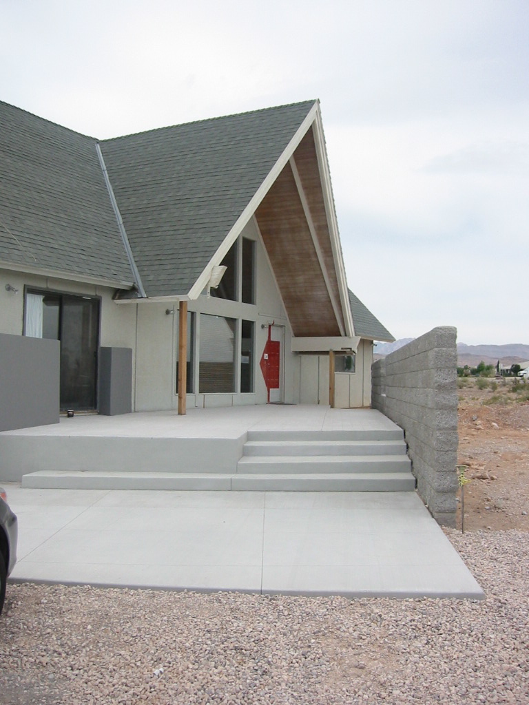 Lookig along the block wall that is the north edge of the new entry terrace. The