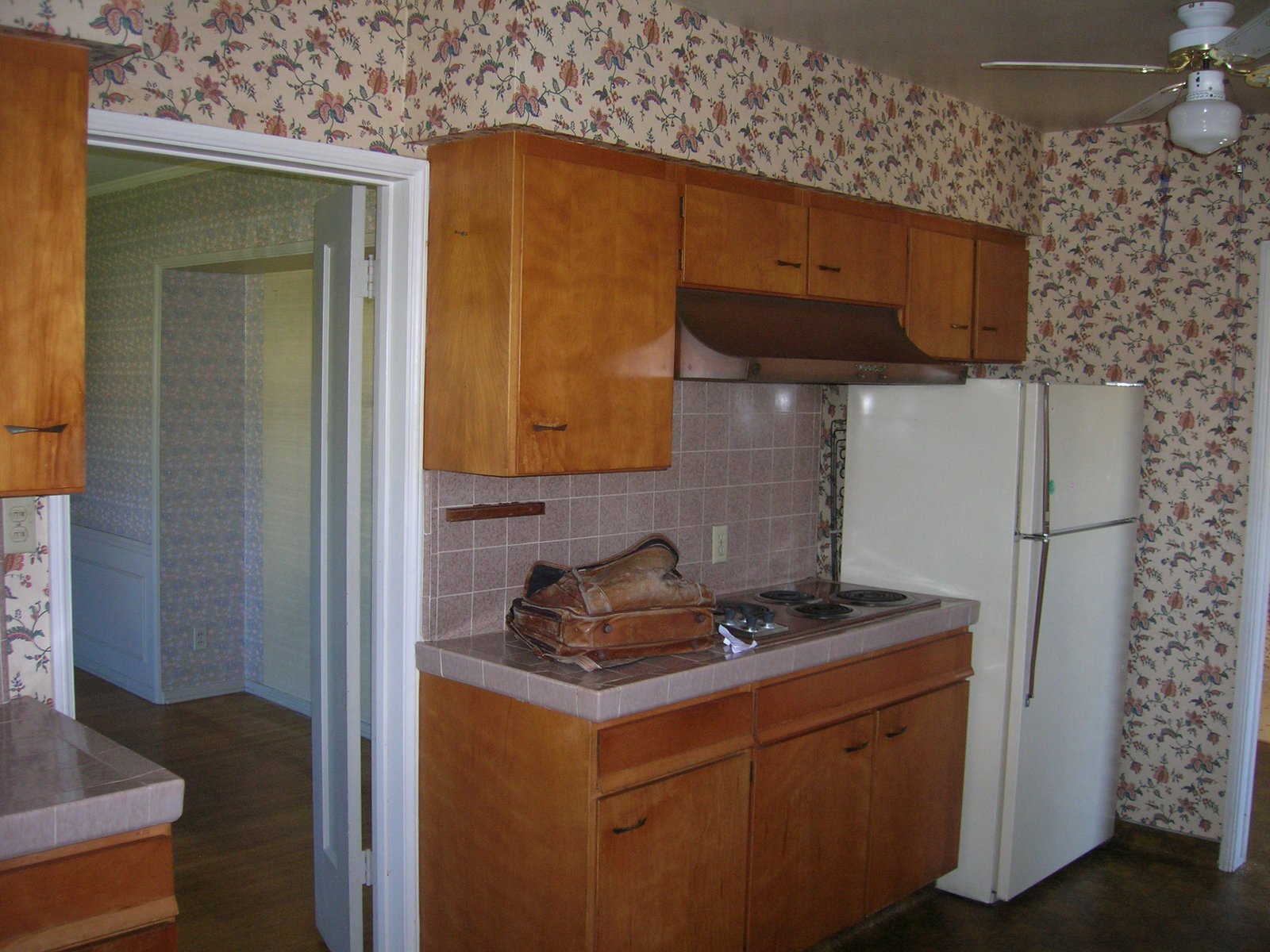 The kitchen was a fine layout, but the soffits over the upper cabinets were inel