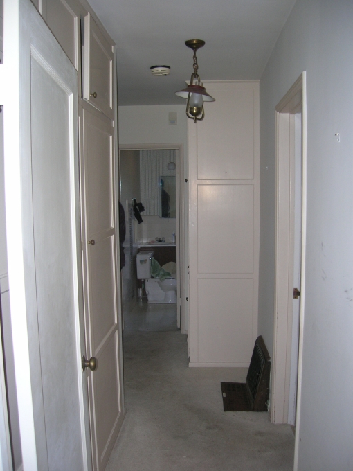 Looking down the hallway to the Master Bathroom and bedrooms. The in-floor heati